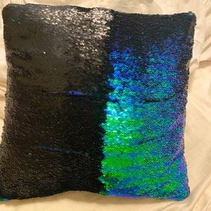 Dual colored sequin pillow.
